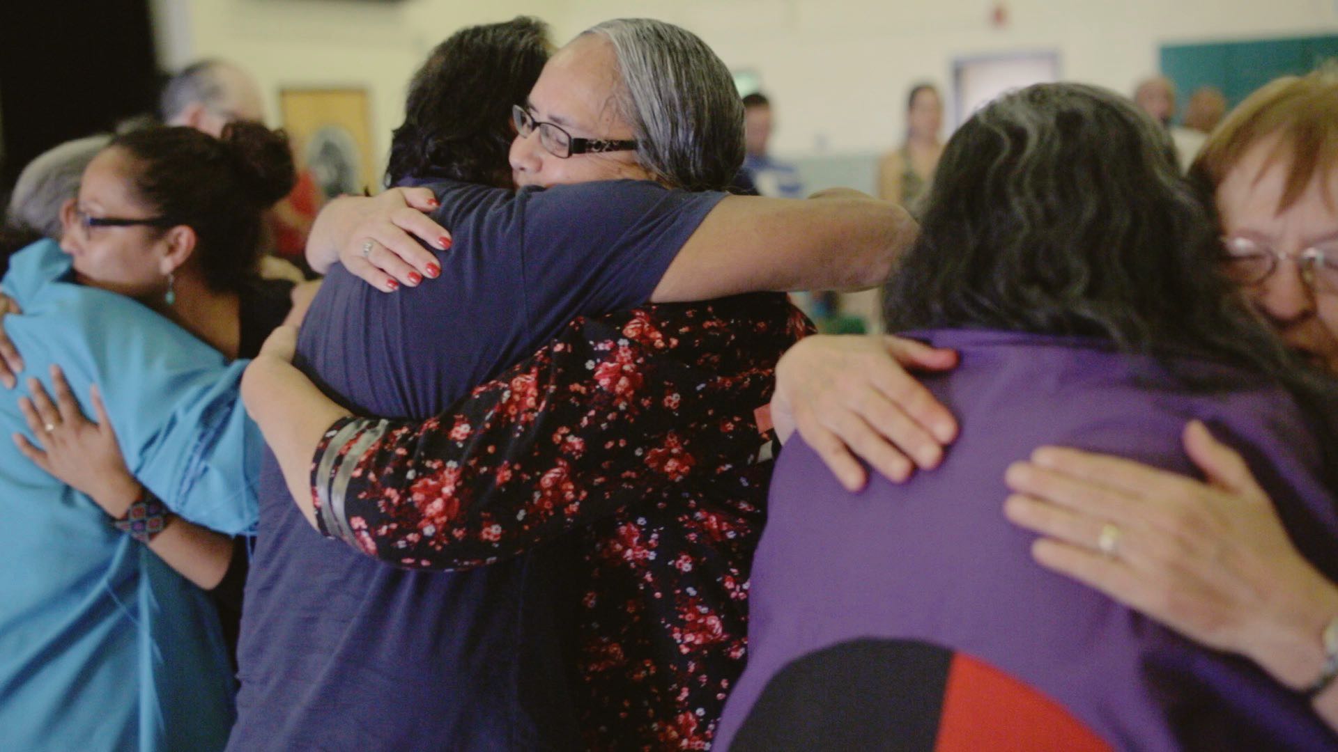 People hugging during event